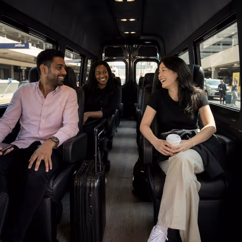 Passengers loading luggage while boarding an Pasadena group shuttle