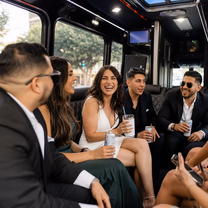 Party bus interior with wraparound leather seating and LED lighting in Pasadena