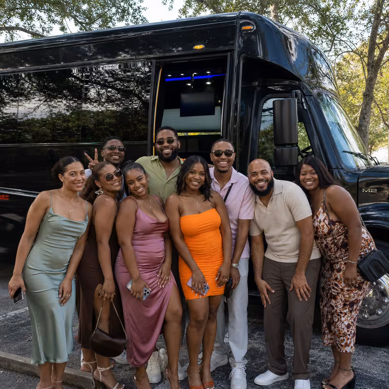 Group boarding a white charter bus for Birthday Transportation transportation in Pasadena