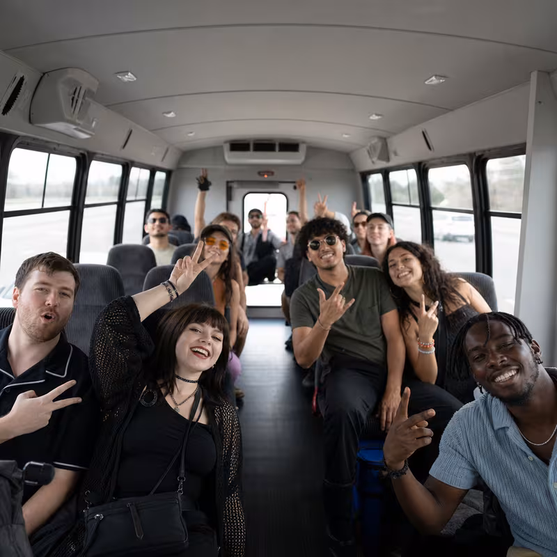 Party bus interior with wraparound leather seating and LED lighting in Pasadena