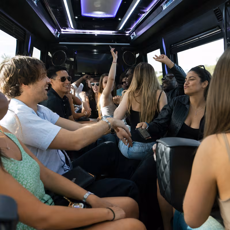 Passengers loading luggage while boarding an Pasadena group shuttle