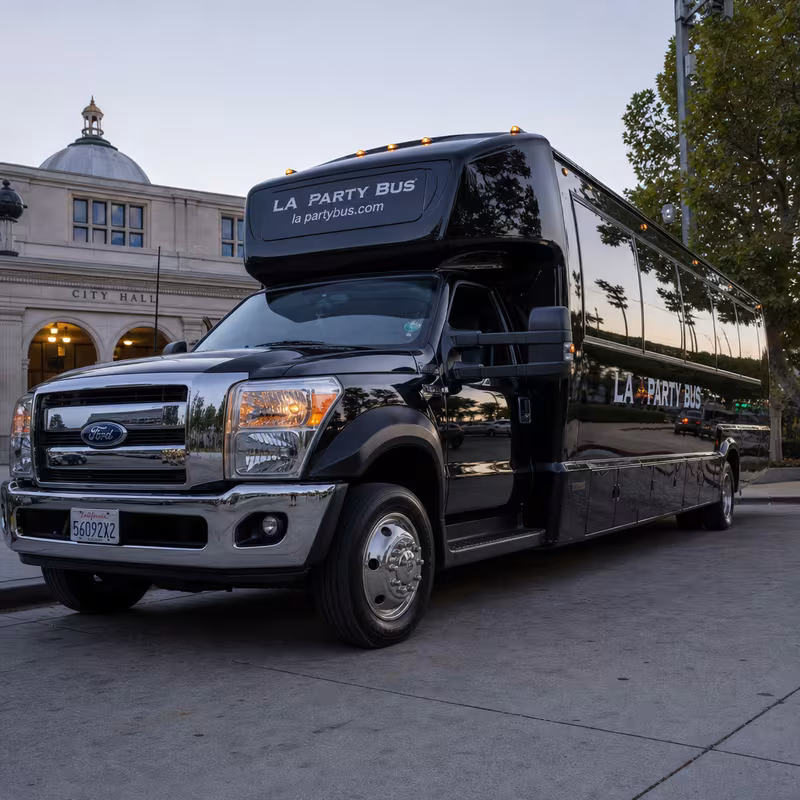 Party bus interior with wraparound leather seating and LED lighting in Pasadena