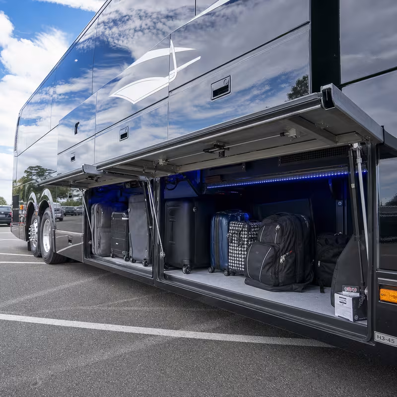Party bus interior with wraparound leather seating and LED lighting in Pasadena