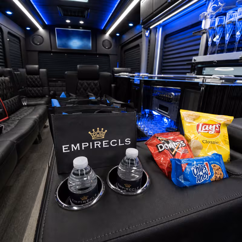 Party bus interior with wraparound leather seating and LED lighting in Pasadena